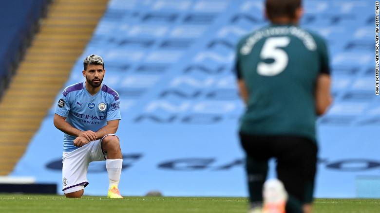 Manchester City striker Sergio Aguero (left) and Burnley defender James Tarkowski take a knee in support of the Black Lives Matter movement.