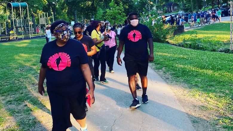 Shawn Dromgoole and his mother,  Lynetra Dunn, on one of their walks.