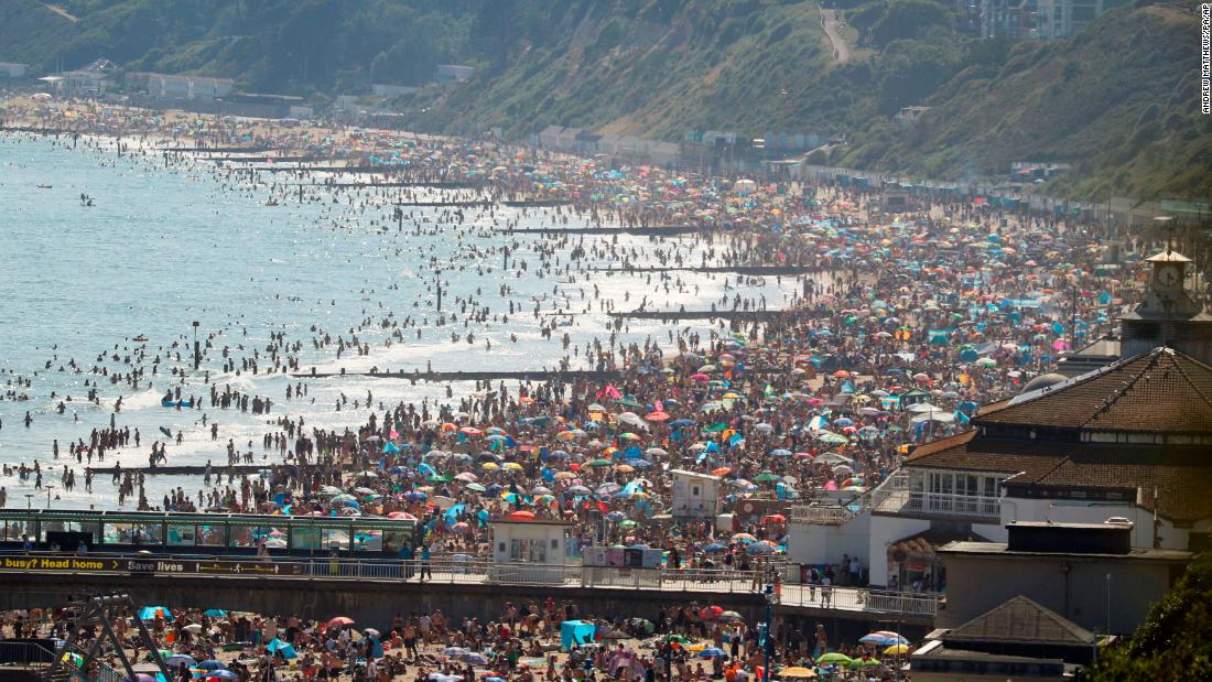 A beach is slammed with people in Bournemouth, England, on June 24. British Prime Minister Boris Johnson &lt;a href=&quot;https://www.cnn.com/2020/05/10/uk/uk-coronavirus-lockdown-boris-johnson-gbr-intl/index.html&quot; target=&quot;_blank&quot;&gt;began easing coronavirus restrictions in May,&lt;/a&gt; but people are still supposed to be distancing themselves from one another.
