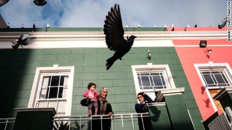 Shamella Dante plays with her neighbour's daughter in Bo-kaap, a formerly coloured area that has now become prime property in the city. Many of it's poorer residents are battling to hold onto their homes due to the effects of gentrification.