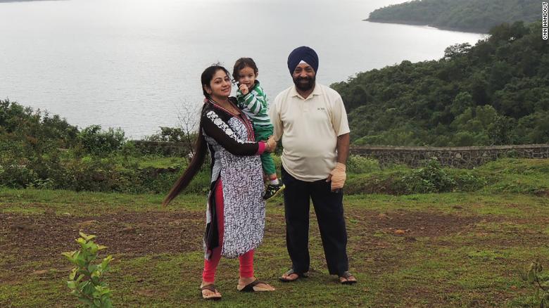 Lakhjeet Singh, 68, tested positive for Covid-19 but couldn&#39;t find a hospital to admit him. He is pictured with his daughter and granddaughter.