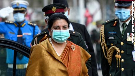 Nepal&#39;s leftist President Bidhya Devi Bhandari wore a mask to the parliament in Kathmandu on May 15 to present the new government&#39;s program.