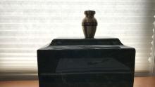 James Mandeville&#39;s ashes sit in an urn in his daughter&#39;s house, a symbol of a tragedy still without conclusion. &quot;We&#39;re waiting to bury him with full military honors,&quot; Beaudette said.