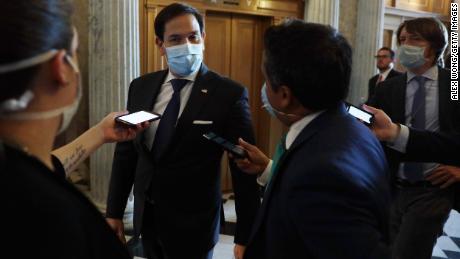 &quot;Everyone should just wear a damn mask,&quot; says Republican Senator Marco Rubio. He followed his own advice as he arrived for a vote in Washington, DC, on June 14.