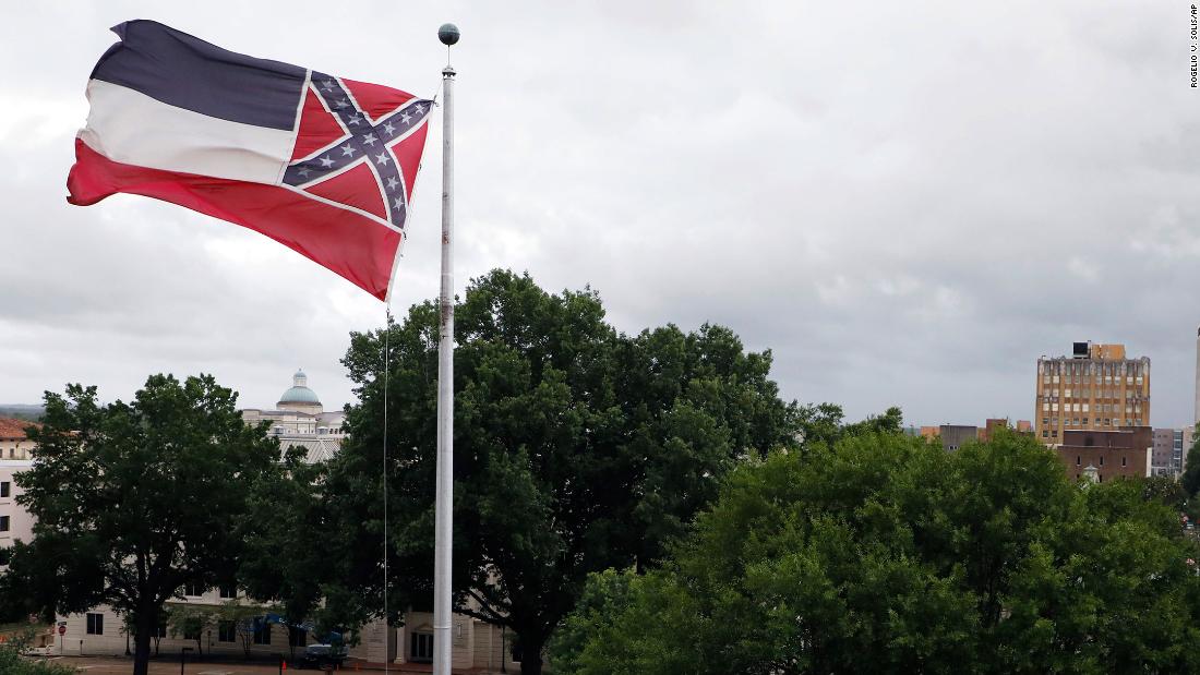 Mississippi governor signs bill to retire flag with Confederate emblem - CNN