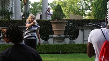 St. Louis couple pulls firearms on protesters cutting through their private street