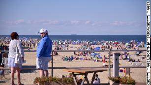 Beaches and bars are being shut down to discourage crowds during the Fourth of July weekend