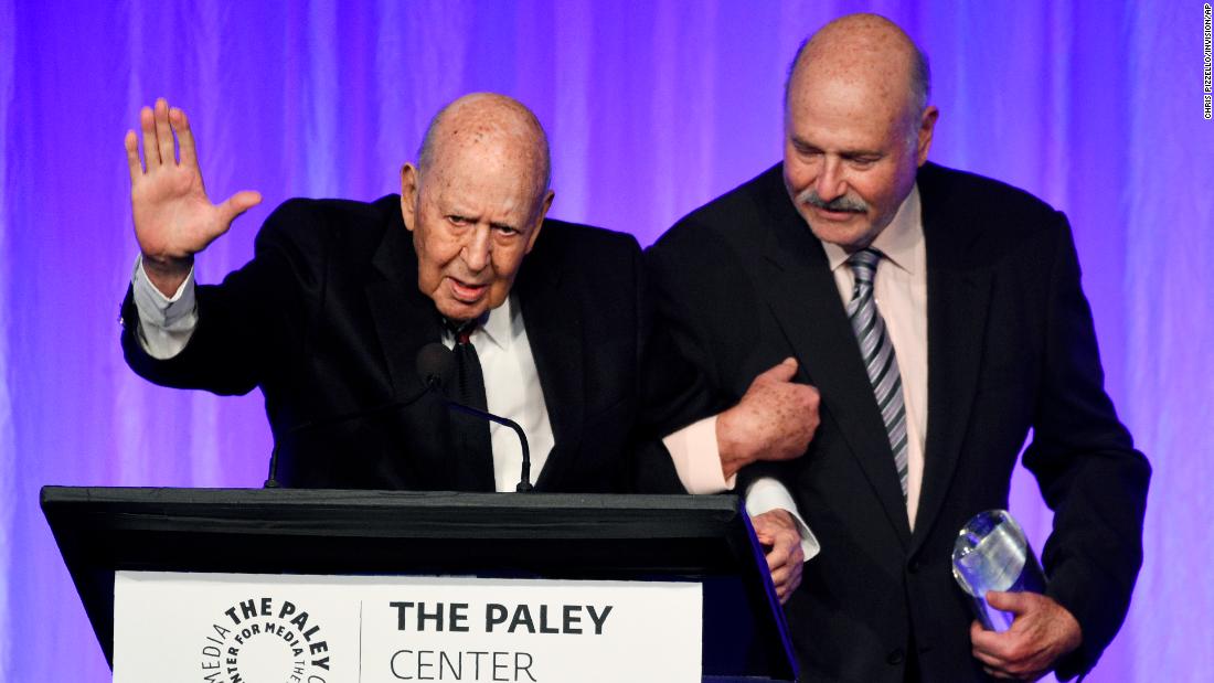 Reiner, left, waves to the audience as he walks with his son Rob during the 2019 &quot;Special Tribute to Television&#39;s Comedy Legends&quot; event held by The Paley Center for Media in Beverly Hills.