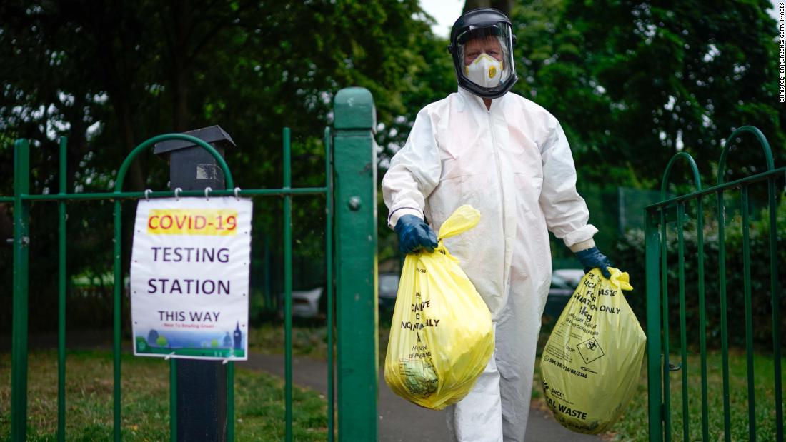 A city council worker carries trash from a coronavirus testing center in Leicester, England, on June 29. Schools and stores in the city of Leicester were closing again, with &lt;a href=&quot;http://www.cnn.com/world/live-news/coronavirus-pandemic-06-30-20-intl/h_64a41a8d1320704c23448d991d0492d2&quot; target=&quot;_blank&quot;&gt;some restrictions being reimposed&lt;/a&gt; because of its high infection rate.