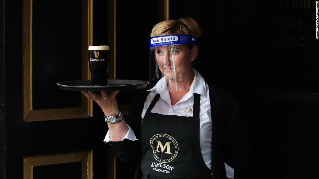 A member of the bar staff at Murray&#39;s Pub serves a pint of Guinness in Dublin, Ireland, on June 29. People in Ireland are tentatively returning to shops, hair salons and restaurants &lt;a href=&quot;http://www.cnn.com/travel/article/ireland-reopens-blarney-stone-scli-intl/index.html&quot; target=&quot;_blank&quot;&gt;as the country emerges from its coronavirus lockdown.&lt;/a&gt;