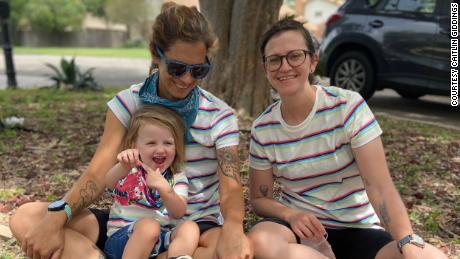 Caitlin Giddings (far right) of Austin, Texas, is shown here with her family. With the rise of Covid-19 cases, she&#39;s considering whether to remove their 2-year-old from day care — for the second time.