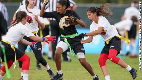 Players participate in the first day of games in the NFL Flag Football Championships.