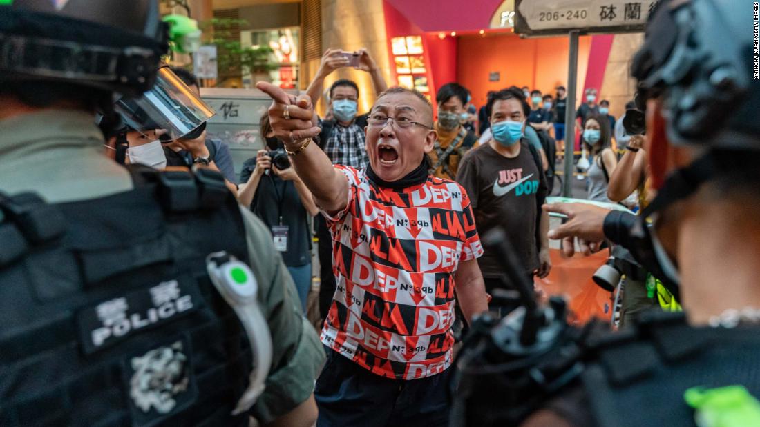 A pro-democracy protester shouts at police during a rally on June 12.