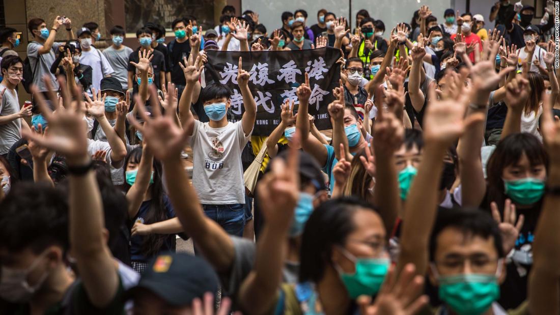 Protesters chant slogans during a rally on July 1. The gesture demands the government to meet their &quot;five demands, not one less.&quot;