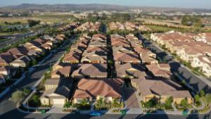 Homes stand in a planned residential community in this aerial photograph taken over Irvine, California, U.S., on Wednesday, May 6, 2020. Mounting economic fallout from the pandemic is fueling apartment landlords' concerns that more tenants will struggle to make their rent payments, even after most managed to come up with the money for April. Photographer: Bing Guan/Bloomberg via Getty Images