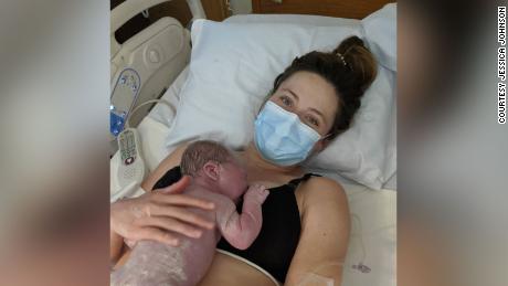 Jessica Johnson holds her baby daughter shortly after giving birth in May.