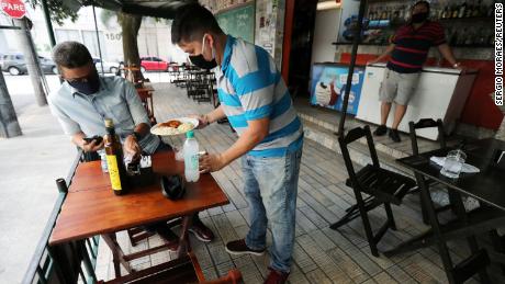 'Sending the population to the slaughterhouse': Restaurants and bars open in Rio, as experts warn worst is yet to come