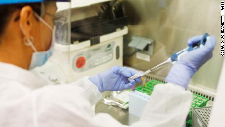 TAMPA, FL - JUNE 25: Adriana Cardenas, a medical technologist processes test samples for the coronavirus at the AdventHealth Tampa labs on June 25, 2020 in Tampa, Florida. Florida is currently experiencing a surge in COVID-19 cases, as the state reached a new record for single-day infections on Wednesday with 5,511 new cases. (Photo by Octavio Jones/Getty Images)