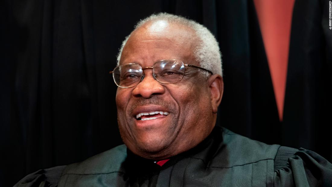 Supreme Court Justice Clarence Thomas takes part in a court photo shoot in November 2018.