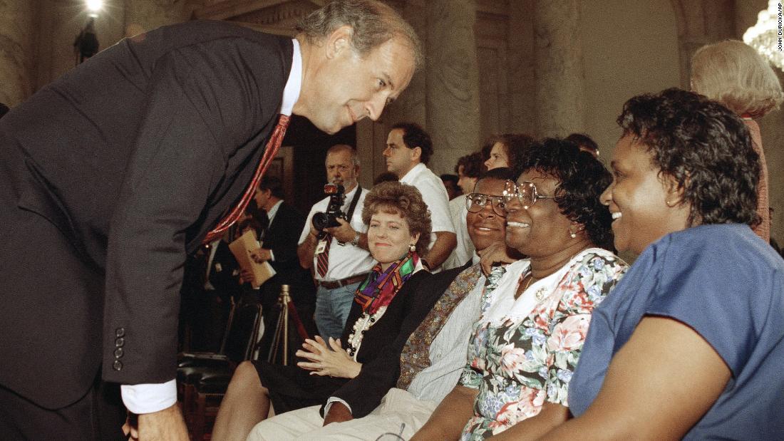 US Sen. Joe Biden, chairman of the Senate Judiciary Committee, meets with members of Thomas&#39; family prior to the start of a hearing in September 1991. From left is Thomas&#39; wife, Virginia; his son, Jamal; his mother, Leola; and his sister Emma Mae.