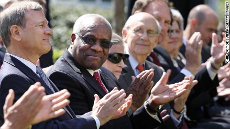 In this April 10, 2017, file photo, Supreme Court Chief Justice John Roberts and associate Justices Clarence Thomas, Ruth Bader Ginsburg, Stephen Breyer and Samuel Alito attend the ceremony where Judge Neil Gorsuch takes the judicial oath during a ceremony in the Rose Garden at the White House.