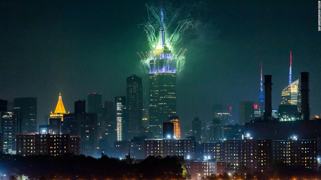 Fireworks burst from the top of the Empire State Building during the Macy&#39;s Fourth of July Fireworks Spectacular in New York City. 