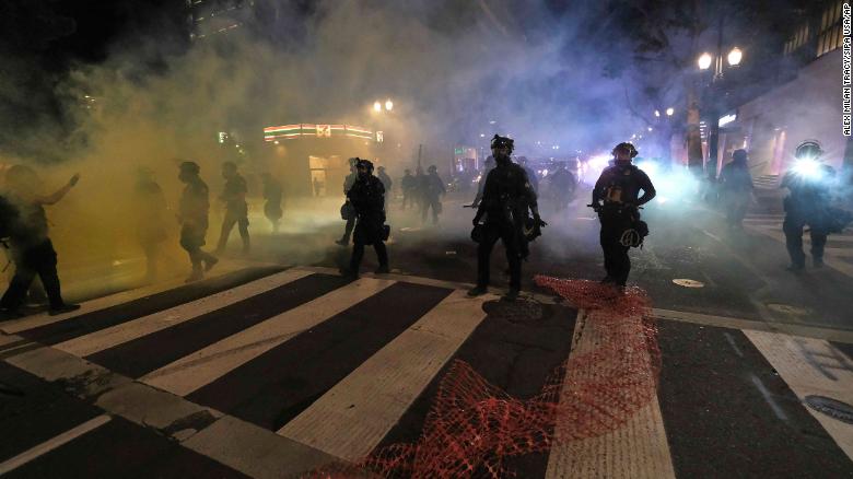 Portland riots: Officers injured after protesters launch fireworks at ...