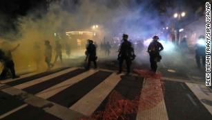 Portland demonstration declared a riot after protesters launch fireworks at federal courthouse