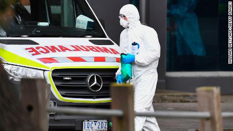 An ambulance is seen outside one of nine public housing estates locked down due to a spike in COVID-19 coronavirus numbers in Melbourne on July 6.