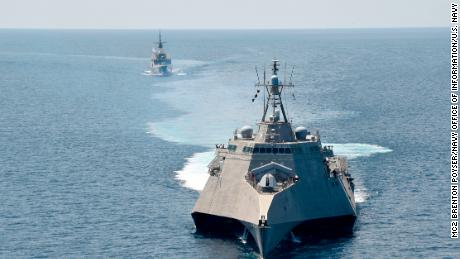 The Independence-variant littoral combat ship USS Gabrielle Giffords, front, takes part in exercises with the Singapore navy&#39;s Formidable-class multi-role stealth frigate RSS Steadfast in the South China Sea, May 25, 2020. 