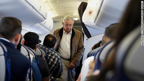 Mexican President Andres Manuel Lopez Obrador boards a commercial flight bound for Culiacan at Mexico City&#39;s international airport, on Feb. 15, 2019.