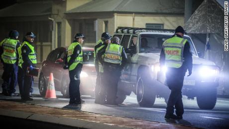 Police stop and question drivers at a checkpoint on July 8 in the Australian border town of Albury.