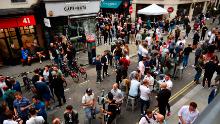 Londoners congregate in Soho, as coronavirus lockdown restrictions eased across the UK on July 4 allowing pubs and restaurants to reopen.