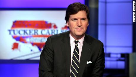 FILE - In this March 2, 2017 file photo, Tucker Carlson, host of &quot;Tucker Carlson Tonight,&quot; poses for photos in a Fox News Channel studio, in New York.  Carlson has advocated restraint in dealing with Iran, and resisted cheerleading the Trump-ordered drone killing of Iranian Gen. Qasem Soleimani. (AP Photo/Richard Drew, File)