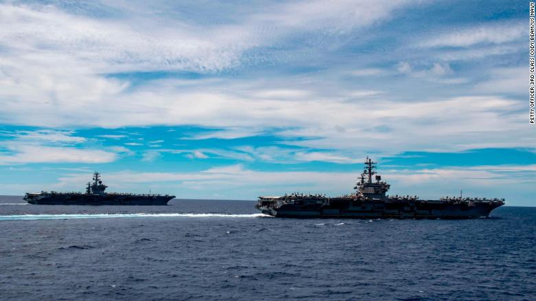 The aircraft carriers USS Nimitz and USS Ronald Reagan transit the South China Sea together last year.