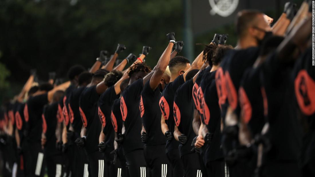  (CNN)One by one the members of Black Players for Change each raised a gloved fist before MLS returned to the soccer field Wednesday night in Orlando.
