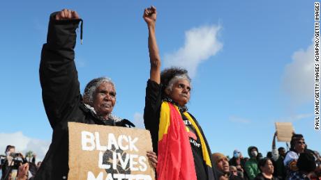 Indigenous protesters show their support during the Black Lives Matter rally in Perth, Australia, on June 13, 2020.