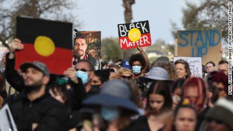 Protesters show their support during a Black Lives Matter rally in Perth, Western Australia, in June 2020.