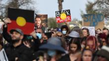 Protesters show their support during a Black Lives Matter rally in Perth, Western Australia, in June 2020.