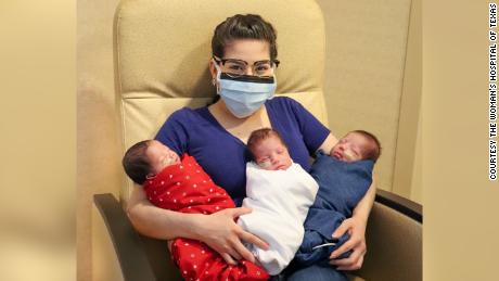 Maggie Sillero holds her triplets, who have almost doubled in size since they were born on June 4.