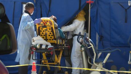 Patients are being triaged inside a tent in the parking lot at El Centro Regional Medical Center.