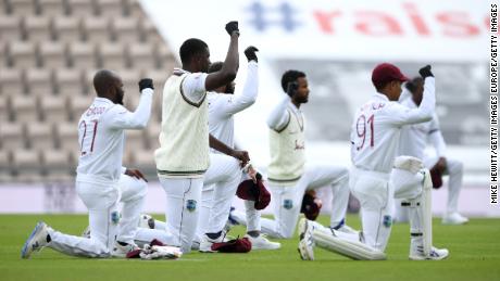 West Indies captain Jason Holder and his teammates take a knee during day one of the fiirst Test match at The Ageas Bowl on July 08, 2020.