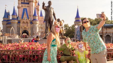 Guests at Magic Kingdom Park, July 11, 2020, at Walt Disney World Resort in Lake Buena Vista, Fla., on the first day of the theme park&#39;s phased reopening.