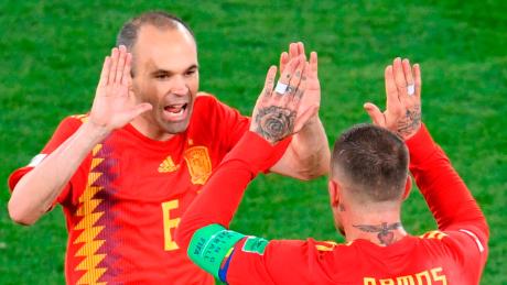 TOPSHOT - Spain's midfielder Andres Iniesta (L) and Spain's defender Sergio Ramos celebrate their second goal during the Russia 2018 World Cup Group B football match between Spain and Morocco at the Kaliningrad Stadium in Kaliningrad on June 25, 2018. (Photo by OZAN KOSE / AFP) / RESTRICTED TO EDITORIAL USE - NO MOBILE PUSH ALERTS/DOWNLOADS        (Photo credit should read OZAN KOSE/AFP via Getty Images)