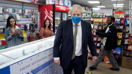The PM wore a mask for the first time in public on Friday, in his Uxbridge constituency, west of London.