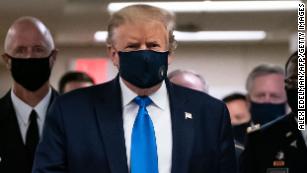 Analysis: Trump gives in to the mask but takes new risks with schools