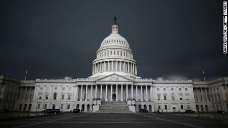 Storm clouds fill the sky over the US Capitol Building.