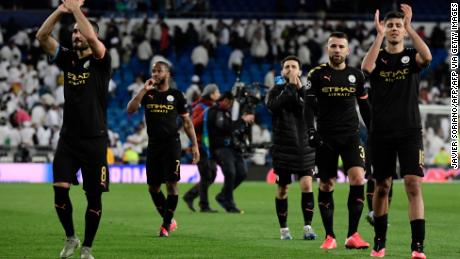 Mnachester City&#39;s players celebrate their win at the end of the UEFA Champions League round of 16 first-leg football match between Real Madrid CF and Manchester City at the Santiago Bernabeu stadium in Madrid on February 26, 2020. (Photo by JAVIER SORIANO / AFP) (Photo by JAVIER SORIANO/AFP via Getty Images)