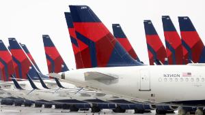 Planes belonging to Delta Airlines sit idle at Kansas City International Airport on April 03, 2020 in Kansas City, Missouri. U.S. carriers reported an enormous drop in bookings amid the spread of the coronavirus and are waiting for a government bailout to fight the impact. Delta lost almost $2 billion in March and parked half of its fleet in order to save money. (Photo by Jamie Squire/Getty Images)