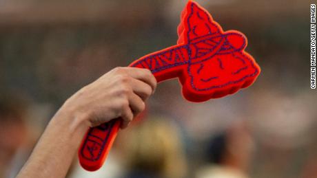 A fan holds a foam tomahawk during Game Five of the National League Division Series between the Atlanta Braves and the St. Louis Cardinals at SunTrust Park on October 9, 2019 in Atlanta.